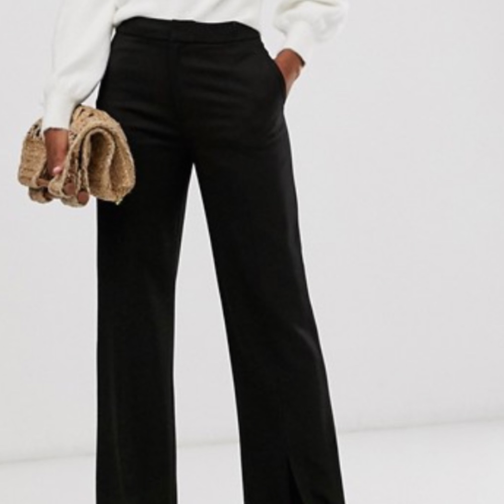 Tailored pants with front slit in black
